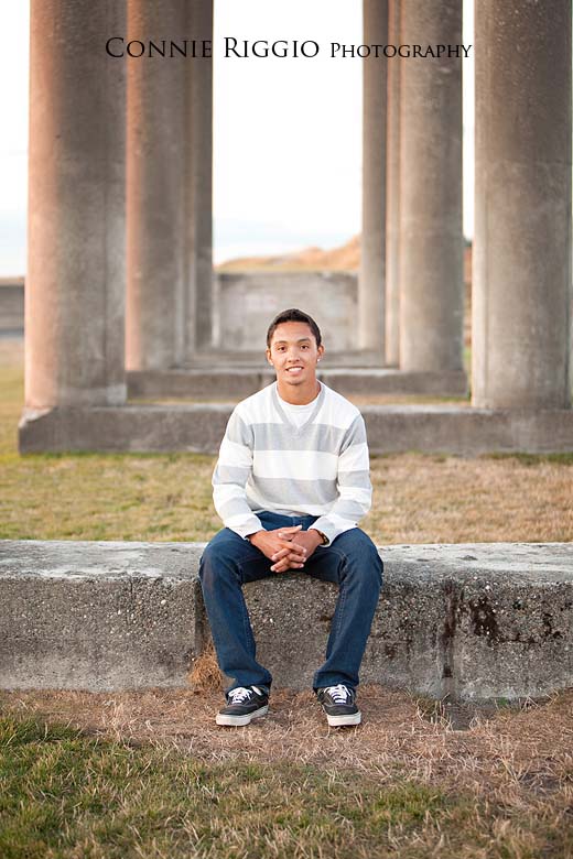 Sitting in middle of pillars Steilacoom Tacoma Seattle Senior Photographer