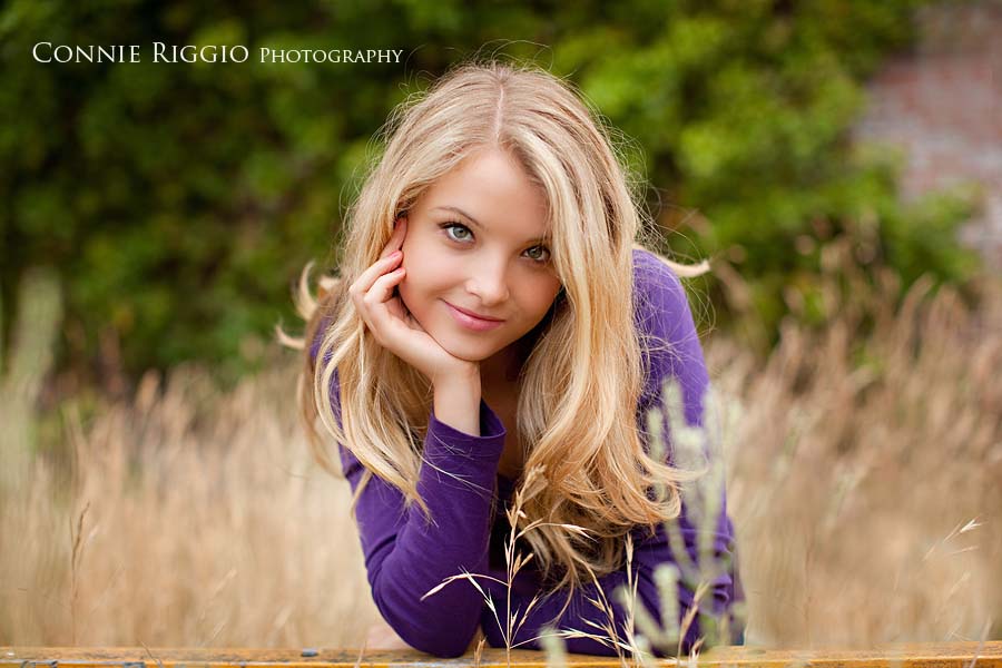 Leaning on rail Tacoma Best Senior Photographer