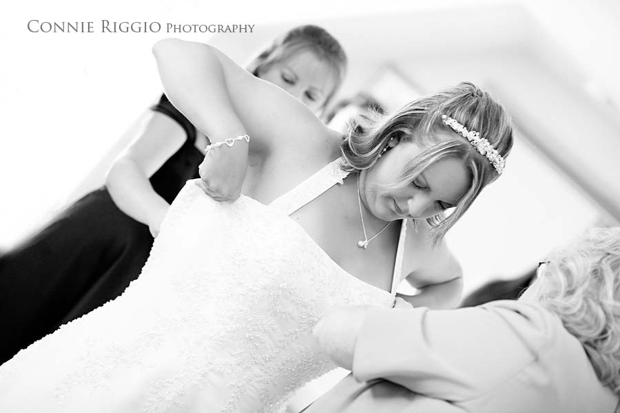 Putting on Dress Tacoma Wedding Photographer