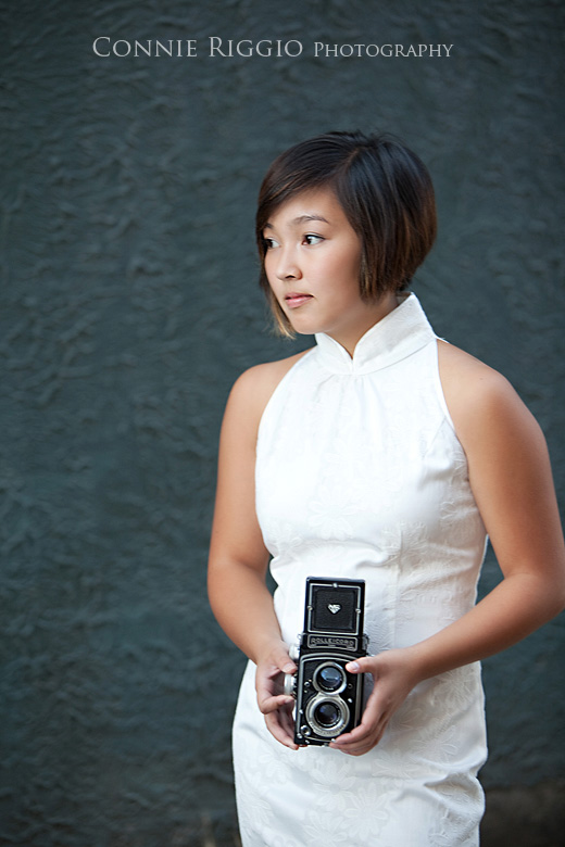 Holding camera Tacoma Seattle Artistic Senior Portrait Photographer
