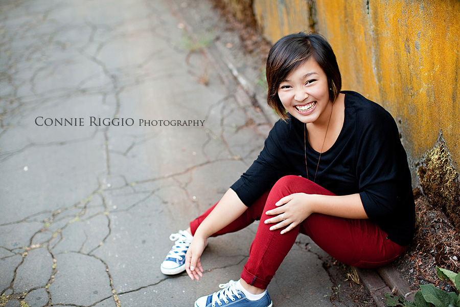 Sitting yellow wall Tacoma Seattle Artistic Senior Portrait Photographer