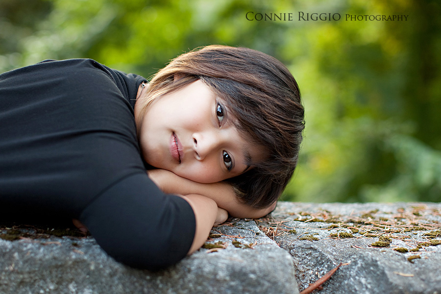 Head down on wall Tacoma Seattle Artistic Senior Portrait Photographer