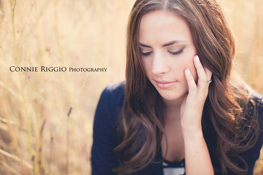 Looking down with hand on face Tacoma Senior Portraits