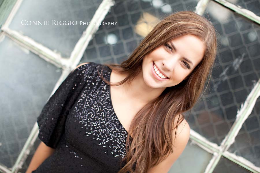 Smiling window Tacoma Senior Portraits