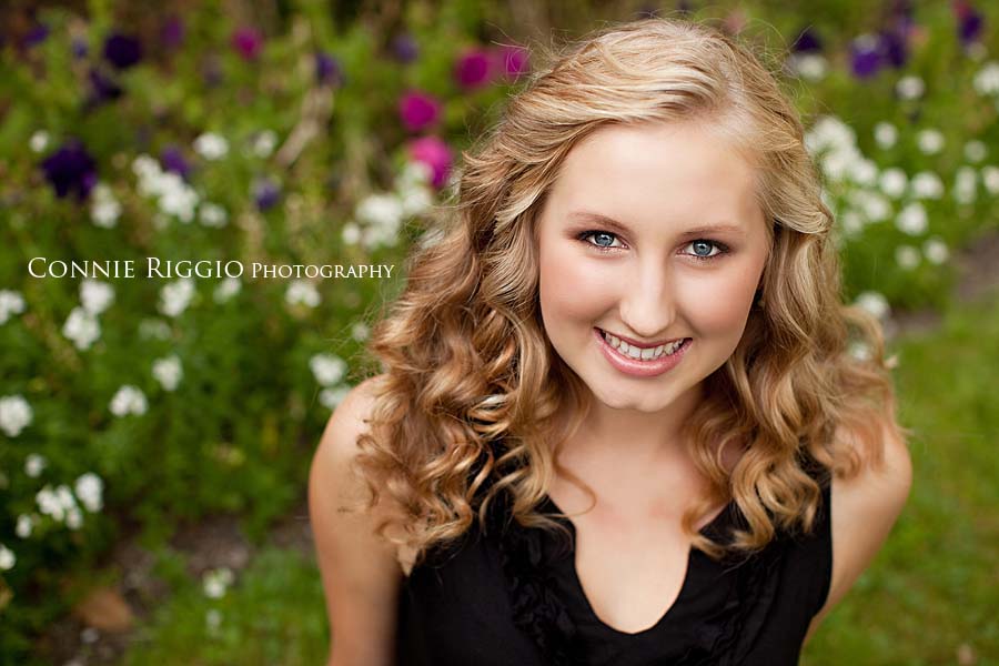 Sitting with flowers Tacoma Curtis Senior Portraits Photographer