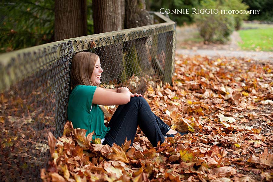 Laughing in leaves Bellarmine Tacoma Senior Portraits